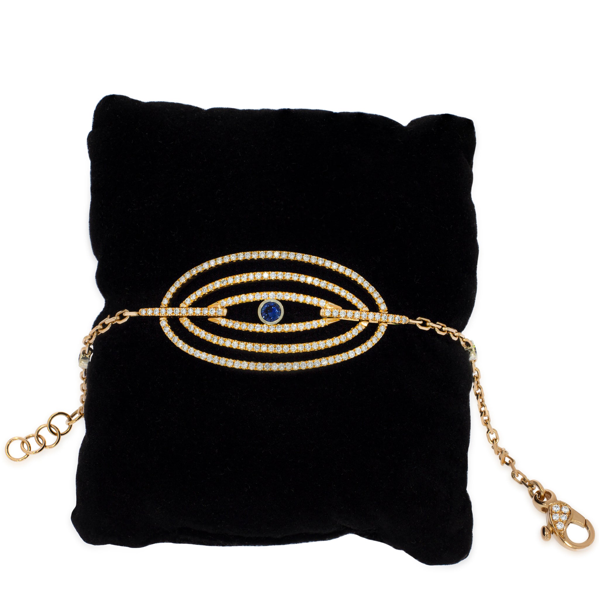 A unique 18k rose gold bracelet, three elliptical rows studded with 1.42 carat diamonds, in the center of which is a blue Sapphire stone.