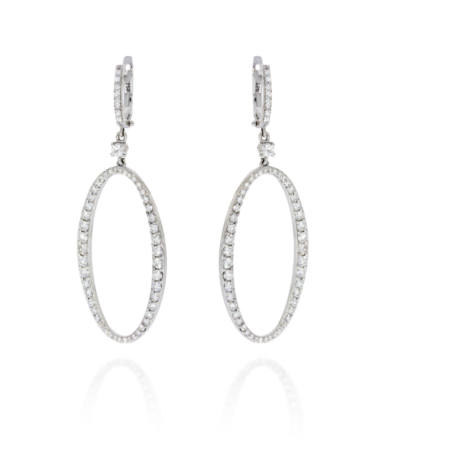Large Dangling Diamond ellipse Earrings in 18k white Gold, create a stunning display of light, adding a touch of glamour in any movment.