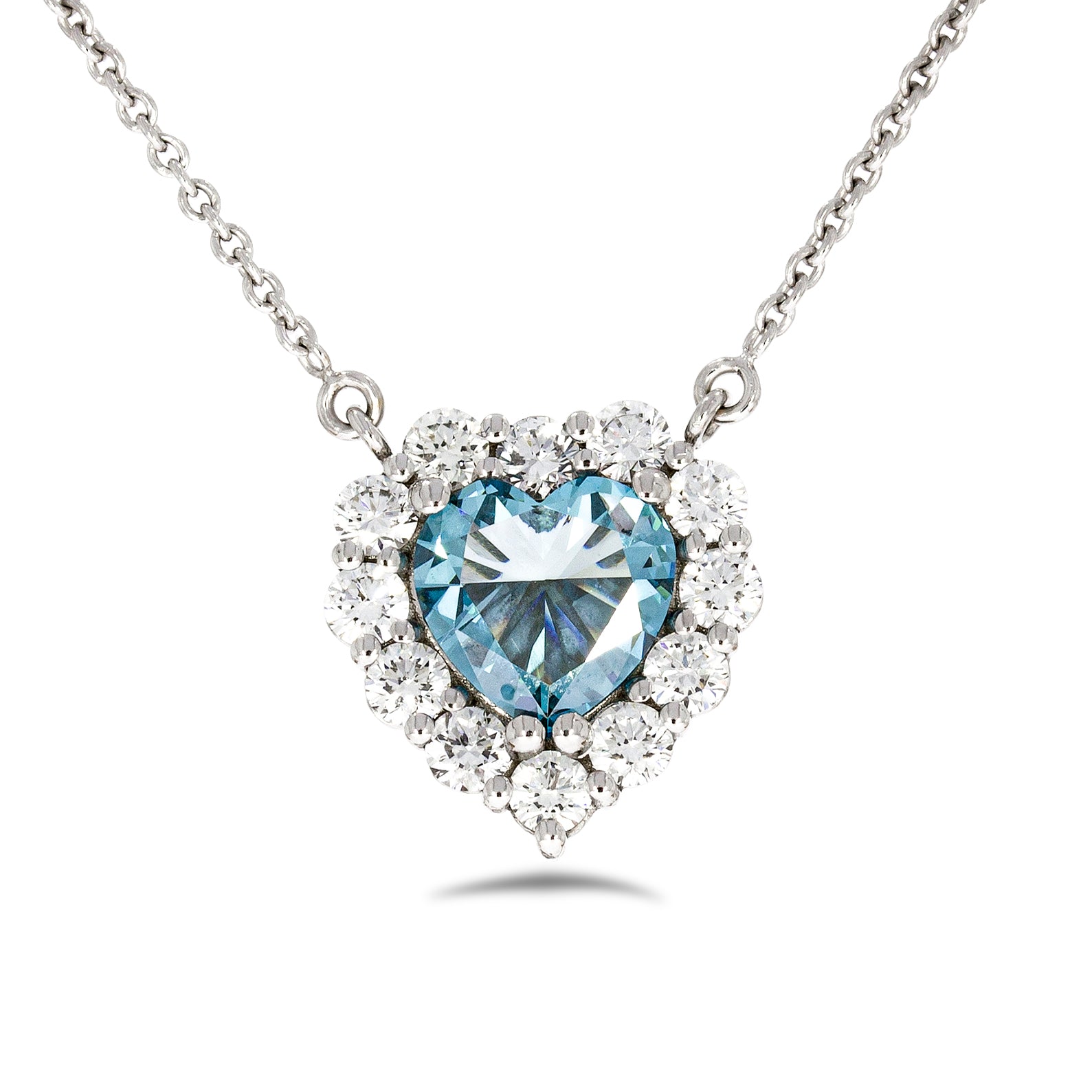 Timeless thick filigree swirl ocean blue diamond Heart shape pendant. 18k white gold set with 0.72ct glamour ocean blue diamond.