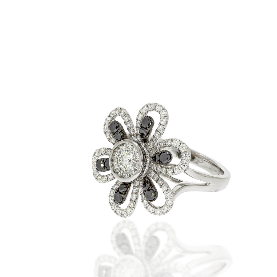 Lovely Daisy ring Daisy petals with black diamonds surrounded by white shining diamonds .
