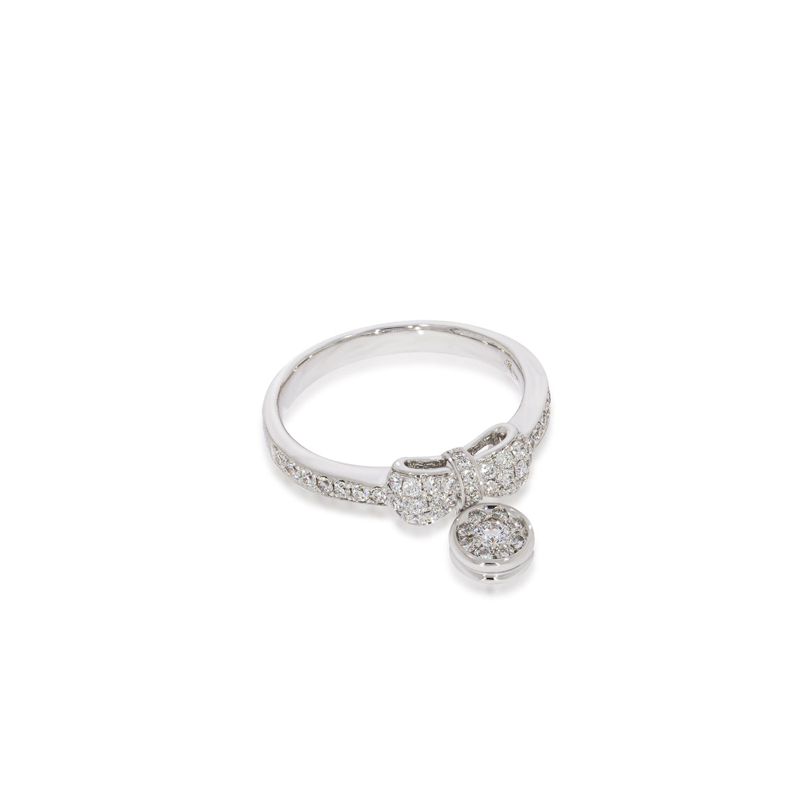 A beautiful diamonds pave in a circle shape dangles from a diamonds band white gold ring wrapped in a elegant pave diamonds bowtie.