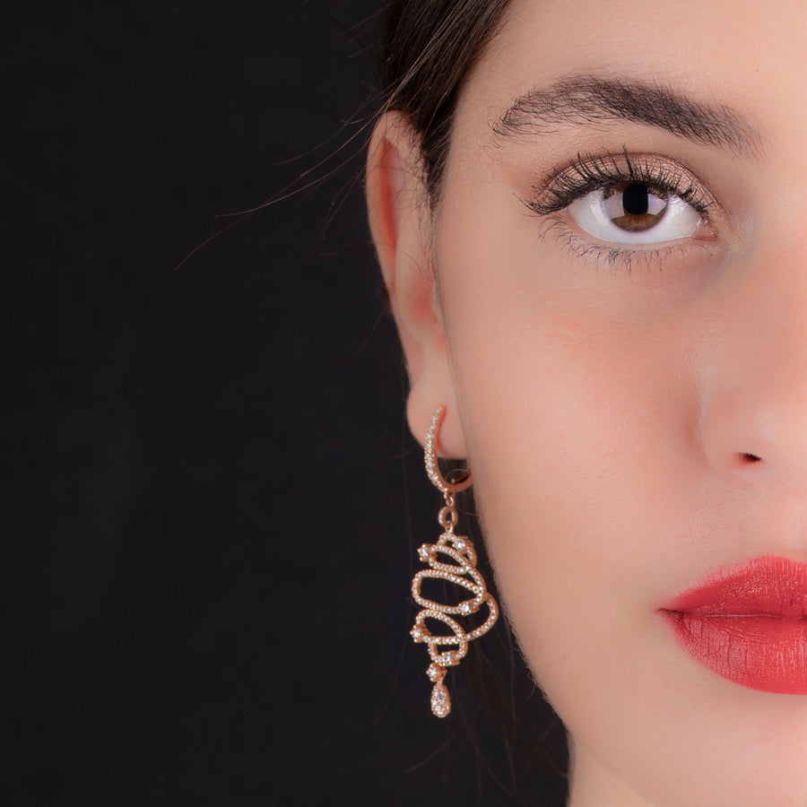 Masterpiece Earrings! Long earing spiral design cast from 18K rose gold and set with 274 sparkling diamonds.